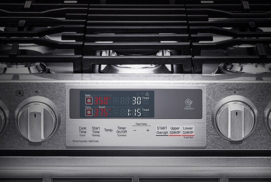 close shot of LG SIGNATURE Oven Range gas cooktop operation part