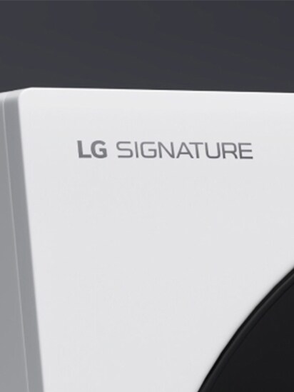 Close up image of the top left hand corner of the LG Signature Washing Machine, clearly showing the LG Signature logo engraving.