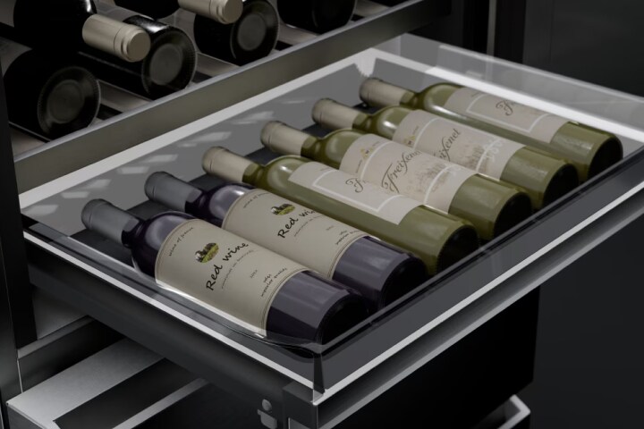 Close-up image of the convertible pantry drawer in an extended state, showing six bottles of wine neatly stored inside.