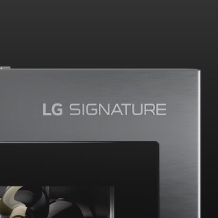 Close-up image of the top right corner of the wine cellar's door, showing the 'LG SIGNATURE’ logo engraved on the premium textured-steel material.