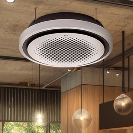 A scene where the LG Round Cassette is installed, harmonizing beautifully with the store lighting.