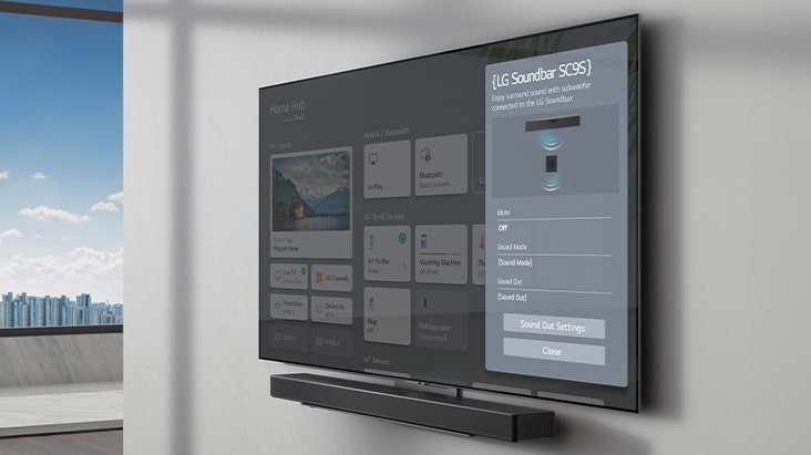 La pantalla de configuración de la barra de sonido LG SC9S se encuentra en el televisor montado en la pared. La barra de sonido también está colgada en la pared justo debajo del televisor.