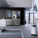 An LG SIGNATURE Refrigerator, Wine Cellar, and Air Purifier complement a sleek kitchen